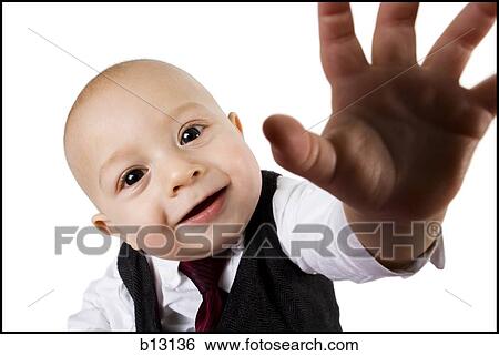 Stock Photograph - Baby boy in business suit reaching. Fotosearch