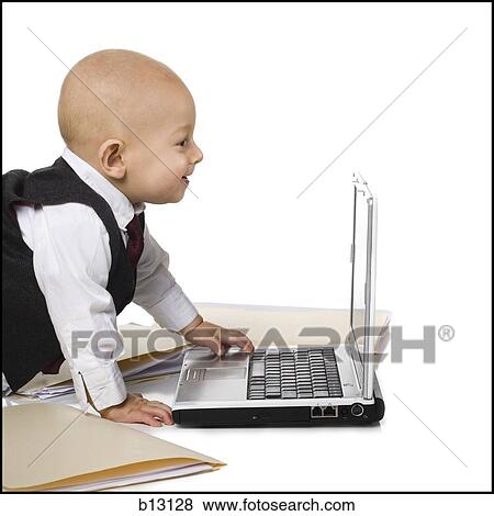 Stock Photo - Baby Boy in suit with laptop. Fotosearch