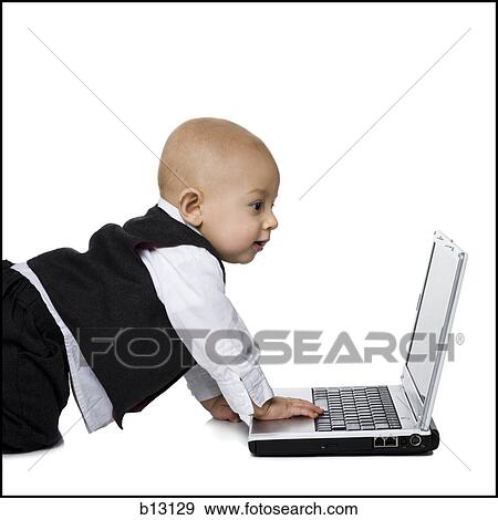 Stock Photo - Baby boy in suit with laptop. Fotosearch
