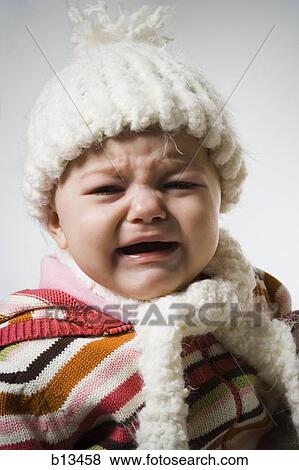 Baby Girl in toque and scarf crying View Large Photo Image Stock Photo - Baby Girl in toque and scarf crying. Fotosearch