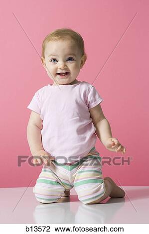 Baby Girl kneeling View Large Photo Image Stock Image - Baby Girl kneeling. Fotosearch