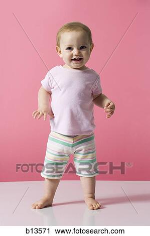 Stock Image - Baby Girl walking. Fotosearch