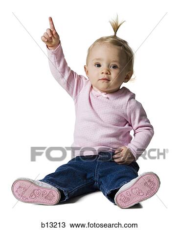 Baby Girl with ponytail pointing up View Large Photo Image Stock Image - Baby Girl with ponytail pointing up. Fotosearch