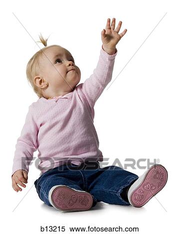 Baby Girl with ponytail reaching up View Large Photo Image Stock Photography - Baby Girl with ponytail reaching up. Fotosearch