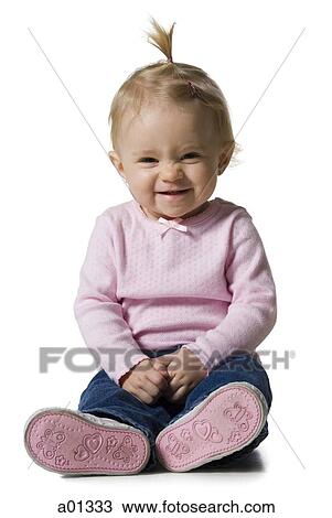 Baby girl with ponytail sitting and smiling View Large Photo Image Stock Image - Baby girl with ponytail sitting and smiling. Fotosearch