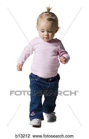 Baby Girl with ponytail walking View Large Photo Image Stock Image - Baby Girl with ponytail walking. Fotosearch