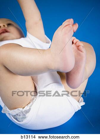 Baby laying on back View Large Photo Image Picture - Baby laying on back. Fotosearch