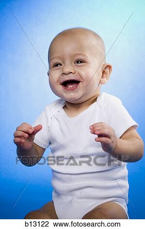Baby sitting and laughing View Large Photo Image Stock Image - Baby sitting and laughing. Fotosearch