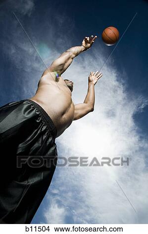 Basketball player shooting ball View Large Photo Image Picture - Basketball player shooting ball. Fotosearch