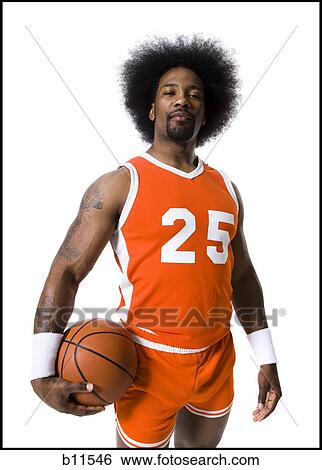 Basketball player with an afro in orange uniform View Large Photo Image Stock Photograph - Basketball player with an afro in orange uniform. Fotosearch