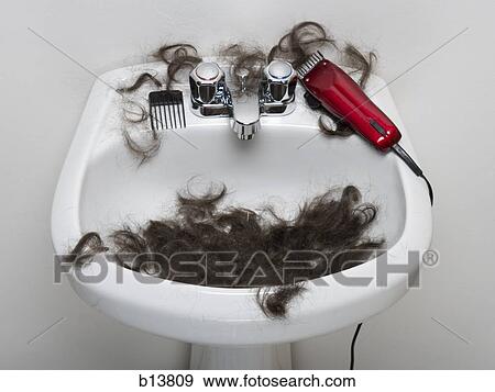 Bathroom sink with hair and electric razor View Large Photo Image Stock Photo - Bathroom sink with hair and electric razor. Fotosearch