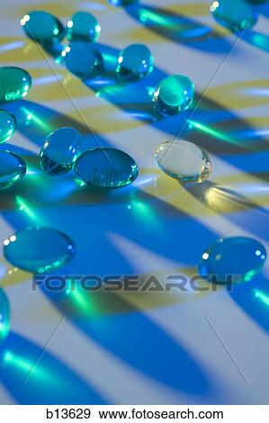 Stock Photo - Blue capsules. Fotosearch