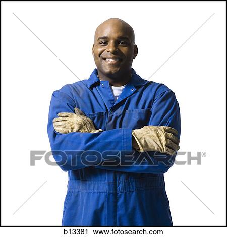 Stock Image - Blue collar worker with gloves. Fotosearch