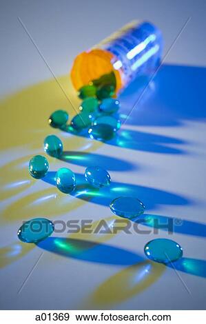 Blue pills in prescription bottle View Large Photo Image Stock Photo - Blue pills in prescription bottle. Fotosearch