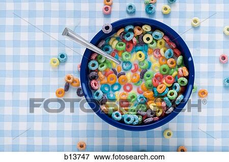 Stock Photo - Bowl of cereal with milk and cereal on tablecloth. Fotosearch