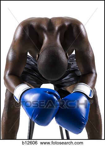 Stock Photograph - Boxer sitting on stool. Fotosearch