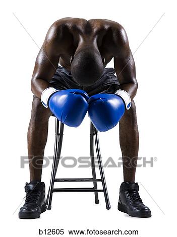 Stock Photography - Boxer sitting on stool. Fotosearch