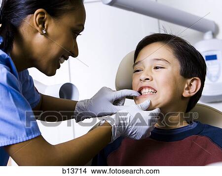 Picture - Boy having dental exam. Fotosearch