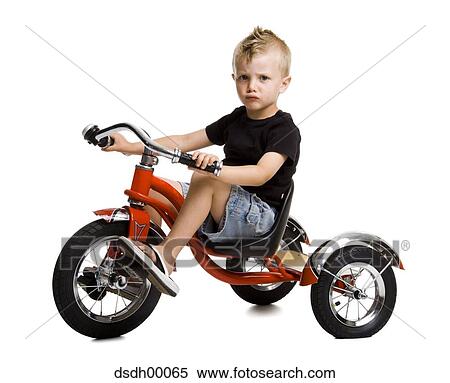 boy on tricycle