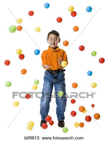 Boy playing with colored balls View Large Photo Image Stock Image - Boy playing with colored balls. Fotosearch
