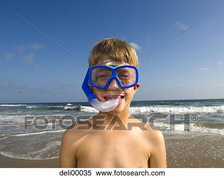 Stock Photography - Boy with diving mask at the beach. Fotosearch