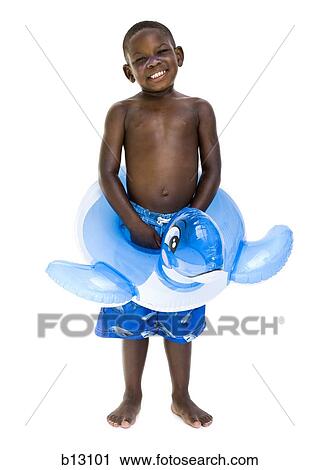 Stock Image - Boy with swim trunks and inflatable toy. Fotosearch
