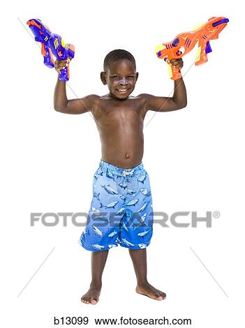 Boy with swim trunks and water pistols View Large Photo Image Stock Photo - Boy with swim trunks and water pistols. Fotosearch