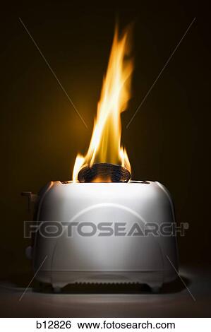 Stock Photograph - Burning toast slices in toaster. Fotosearch