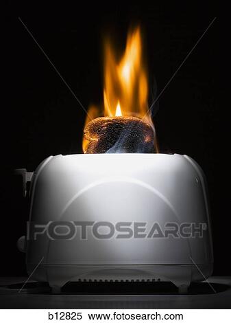 Burning toast slices in toaster View Large Photo Image Stock Photography - Burning toast slices in toaster. Fotosearch