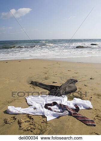 Business attire on sandy beach no people View Large Photo Image Picture - Business attire on sandy beach no people. Fotosearch