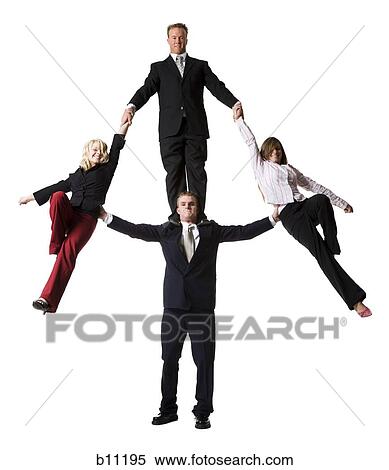 Business people creating a human pyramid View Large Photo Image Stock Photography - Business people creating a human pyramid. Fotosearch