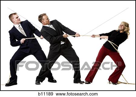 Stock Photo - Business people engaged in a tug of war contest. Fotosearch