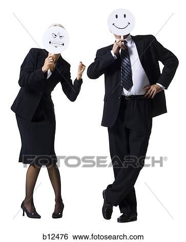 Businessman and businesswoman holding expression masks View Large Photo Image Stock Photograph - Businessman and businesswoman holding expression masks. Fotosearch