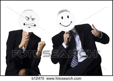 Stock Photography - Businessman and businesswoman holding expression masks. Fotosearch