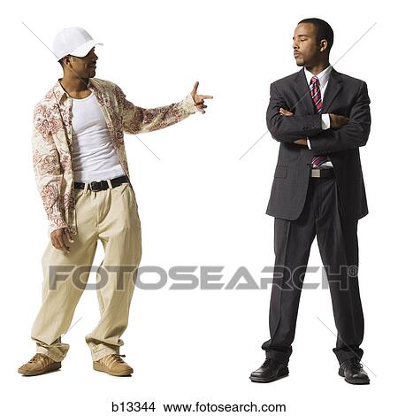 Businessman and casually dressed twins View Large Photo Image Picture - Businessman and casually dressed twins. Fotosearch
