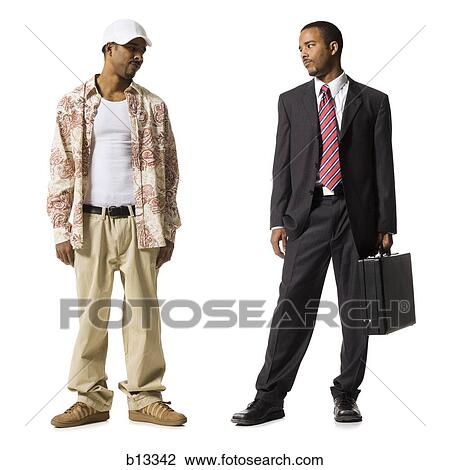 Stock Image - Businessman and casually dressed twins. Fotosearch