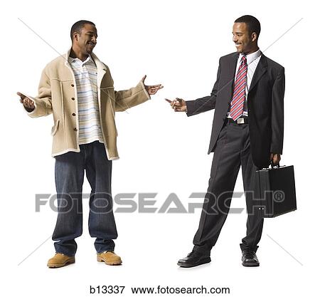 Businessman and casually dressed twins View Large Photo Image Stock Photo - Businessman and casually dressed twins. Fotosearch