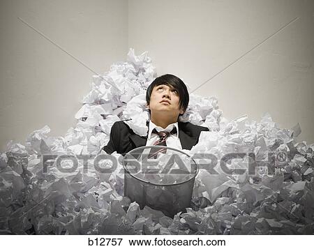 Businessman buried in mountain of crumpled papers View Large Photo Image Stock Photo - Businessman buried in mountain of crumpled papers. Fotosearch