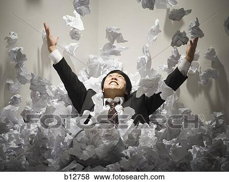Businessman buried in mountain of crumpled papers View Large Photo Image Stock Photo - Businessman buried in mountain of crumpled papers. Fotosearch