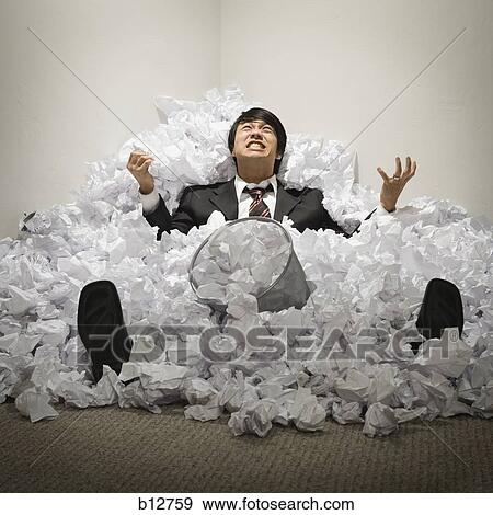 Businessman buried in mountain of crumpled papers View Large Photo Image Stock Photo - Businessman buried in mountain of crumpled papers. Fotosearch