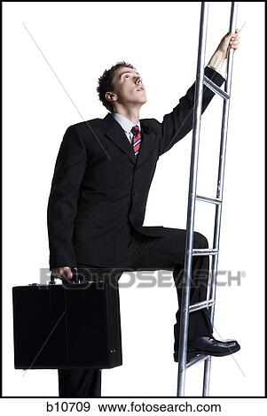 Businessman climbing corporate ladder View Large Photo Image Stock Photo - Businessman climbing corporate ladder. Fotosearch