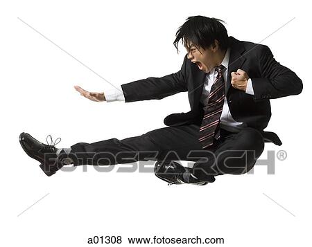 Businessman doing a karate kick View Large Photo Image Stock Photo - Businessman doing a karate kick. Fotosearch