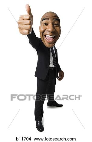 Businessman giving thumbs-up signal View Large Photo Image Picture - Businessman giving thumbs-up signal. Fotosearch