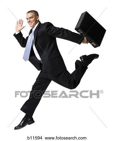Businessman jumping with briefcase View Large Photo Image Picture - Businessman jumping with briefcase. Fotosearch