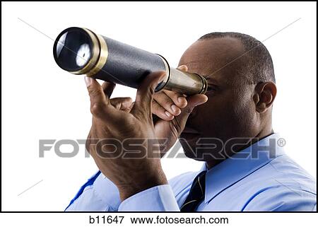 Stock Photo - Businessman looking through telescope. Fotosearch