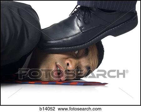 Businessman lying down being stepped on View Large Photo Image Stock Image - Businessman lying down being stepped on. Fotosearch