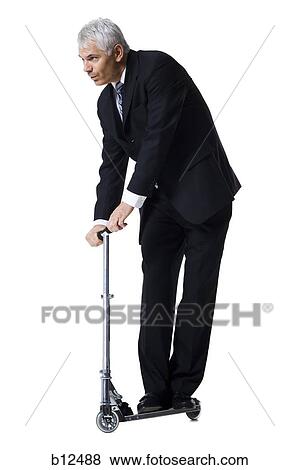 Businessman on a scooter View Large Photo Image Stock Photo - Businessman on a scooter. Fotosearch