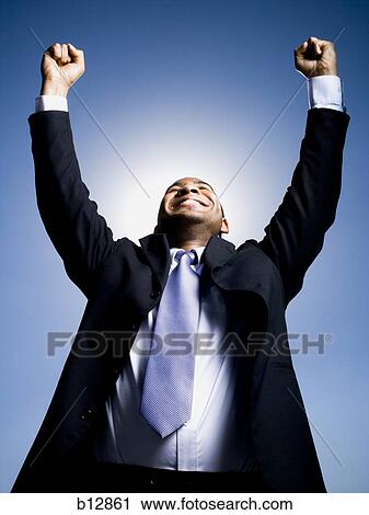 Businessman pumping fists in the air View Large Photo Image Stock Image - Businessman pumping fists in the air. Fotosearch