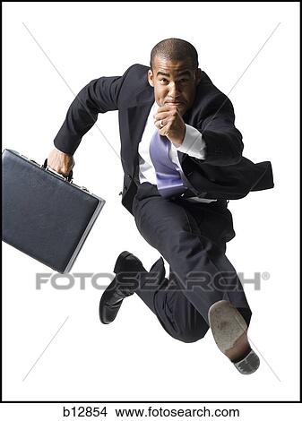 Picture - Businessman running with briefcase. Fotosearch