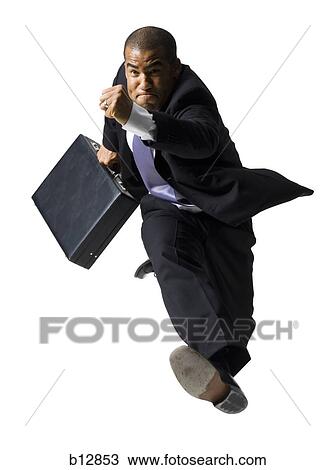 Businessman running with briefcase View Large Photo Image Stock Image - Businessman running with briefcase. Fotosearch